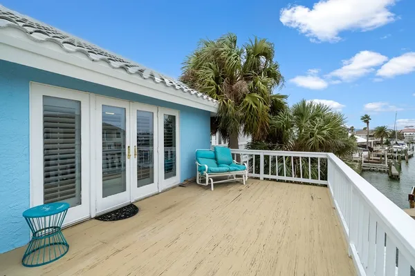 a balcony with view of swimming pool