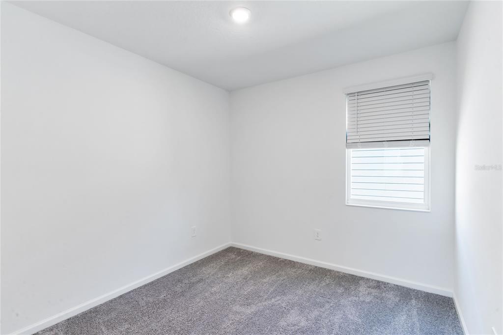 15524 Water Spring Boulevard Winter Garden, FL 34787 - Photo 24 of 40 an empty room with a window