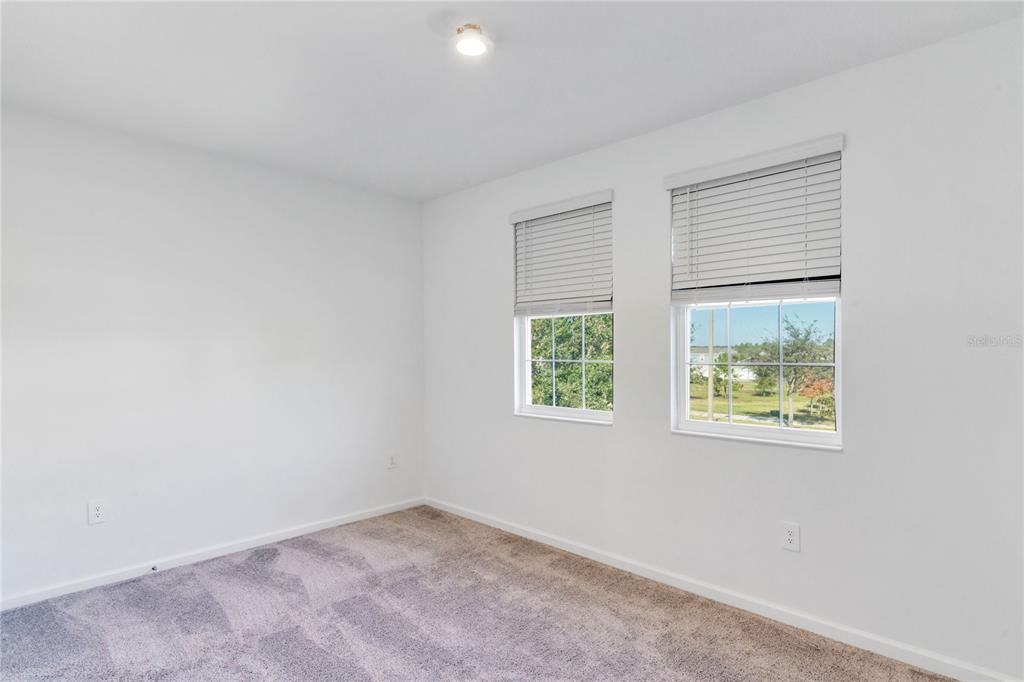 15524 Water Spring Boulevard Winter Garden, FL 34787 - Photo 26 of 40 an empty room with windows