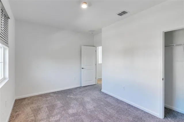 a bathroom with a toilet a sink and a mirror