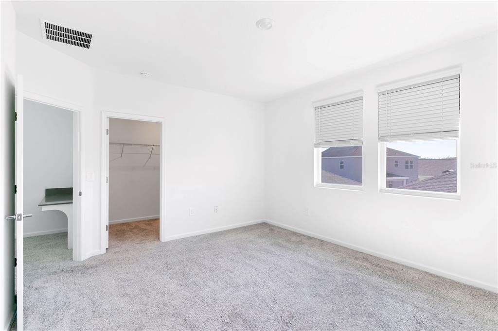 15524 Water Spring Boulevard Winter Garden, FL 34787 - Photo 34 of 40 an empty room with windows and closet