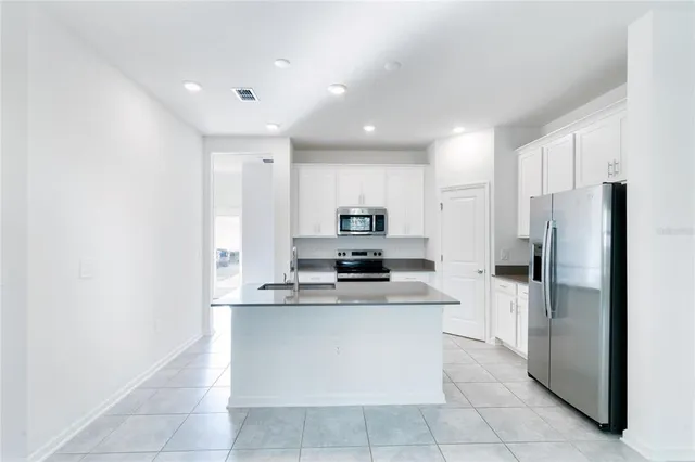 a large kitchen with cabinets