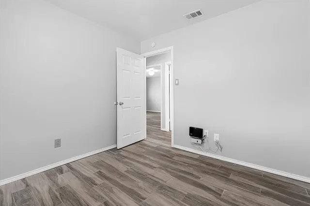 a view of a livingroom with wooden floor