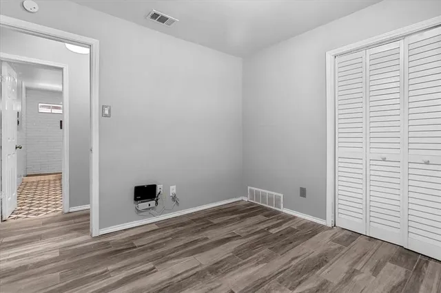 a view of a livingroom with wooden floor