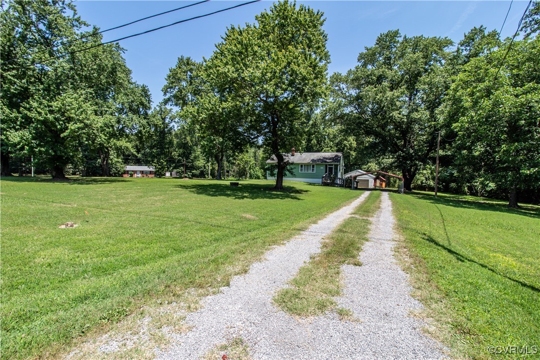 a view of a house with a yard