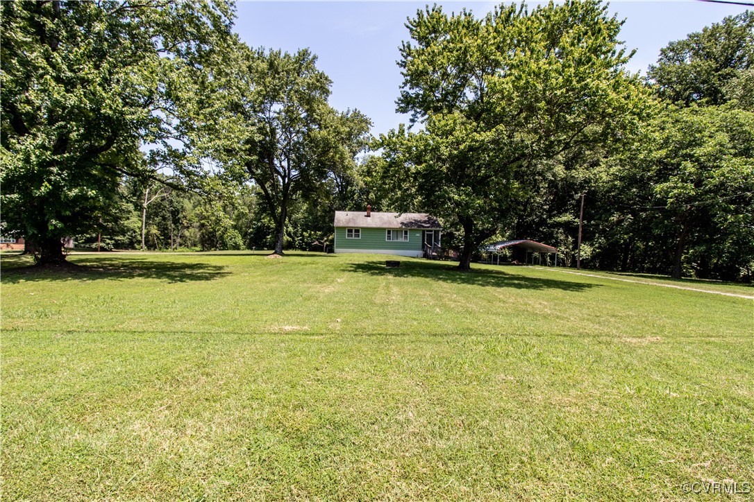 2400 East Hundred Road Chester, VA 23836 - Photo 20 of 27 a view of a swimming pool with an outdoor space and seating area