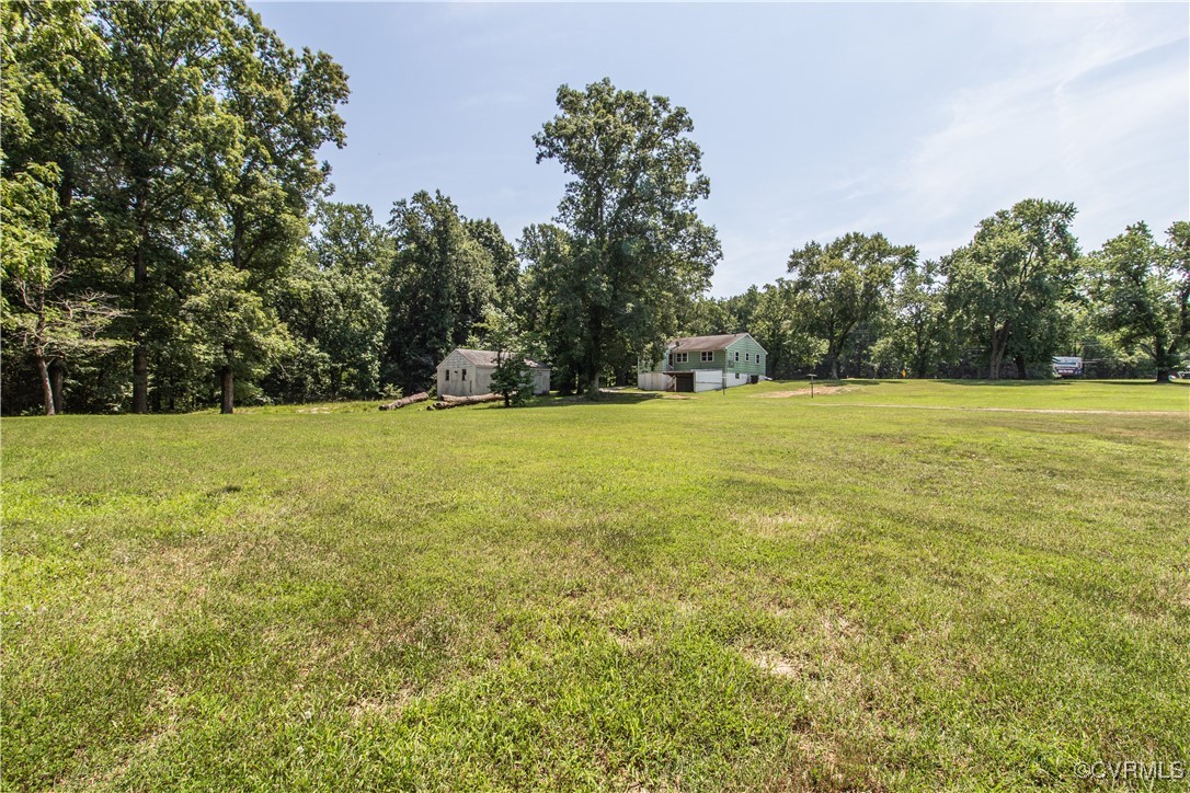 2400 East Hundred Road Chester, VA 23836 - Photo 22 of 27 a view of a field with trees in the background