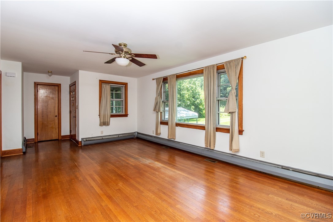 2400 East Hundred Road Chester, VA 23836 - Photo 3 of 27 an empty room with wooden floor and windows