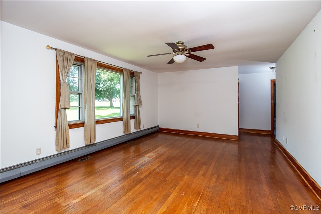 2400 East Hundred Road Chester, VA 23836 - Photo 4 of 27 a view of empty room with wooden floor and fan