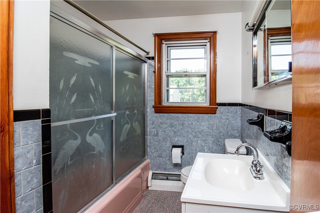 2400 East Hundred Road Chester, VA 23836 - Photo 7 of 27 a bathroom with a sink a toilet and shower