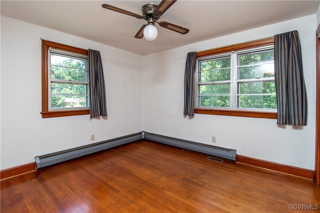 2400 East Hundred Road Chester, VA 23836 - Photo 8 of 27 a view of an empty room with a window and wooden floor