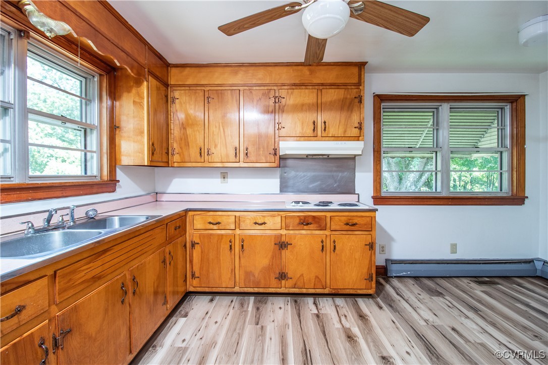 2400 East Hundred Road Chester, VA 23836 - Photo 10 of 27 a kitchen with wooden floors and windows