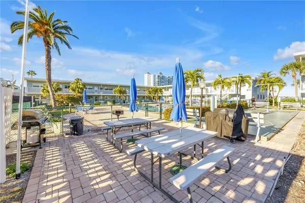 a view of a patio with swimming pool