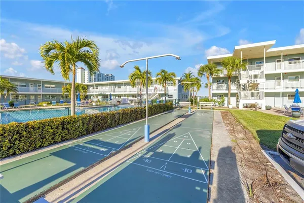 a view of a swimming pool with a patio