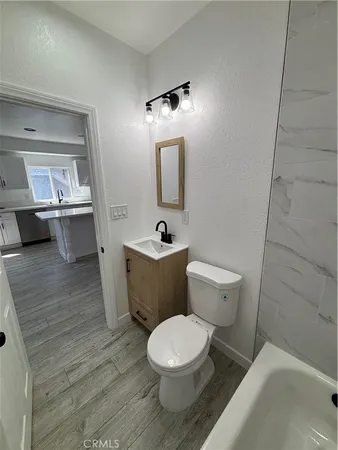 a bathroom with a bathtub and a toilet