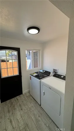 a kitchen with a stove and a refrigerator