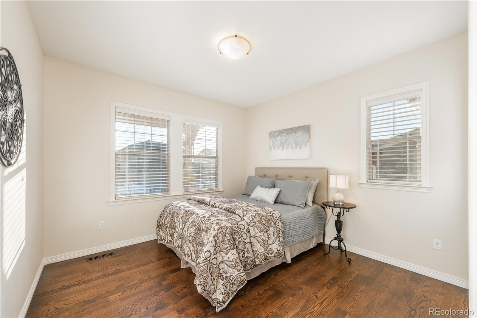 10646 Sundial Rim Road Highlands Ranch, CO 80126 - Photo 13 of 40 a bedroom with a bed and a window