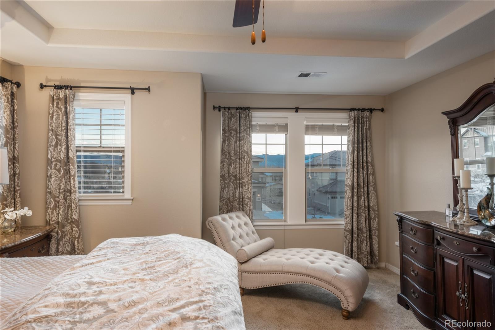 10646 Sundial Rim Road Highlands Ranch, CO 80126 - Photo 17 of 40 a bedroom with a large bed and a window