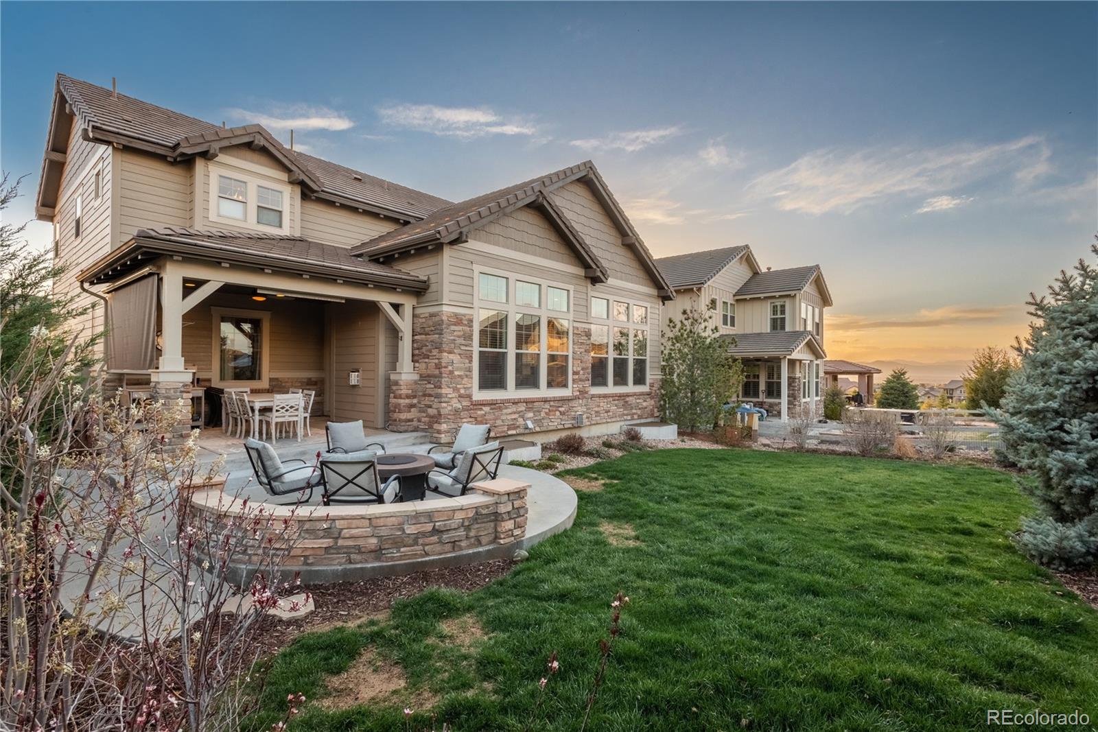 10646 Sundial Rim Road Highlands Ranch, CO 80126 - Photo 2 of 40 a front view of a house with garden