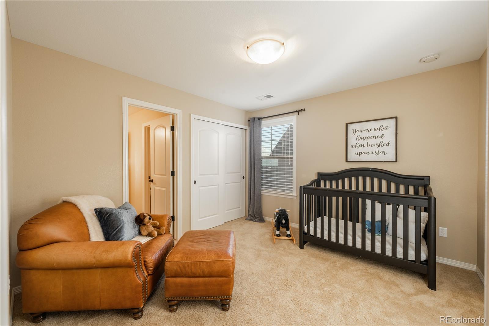 10646 Sundial Rim Road Highlands Ranch, CO 80126 - Photo 22 of 40 a bedroom with furniture and a window