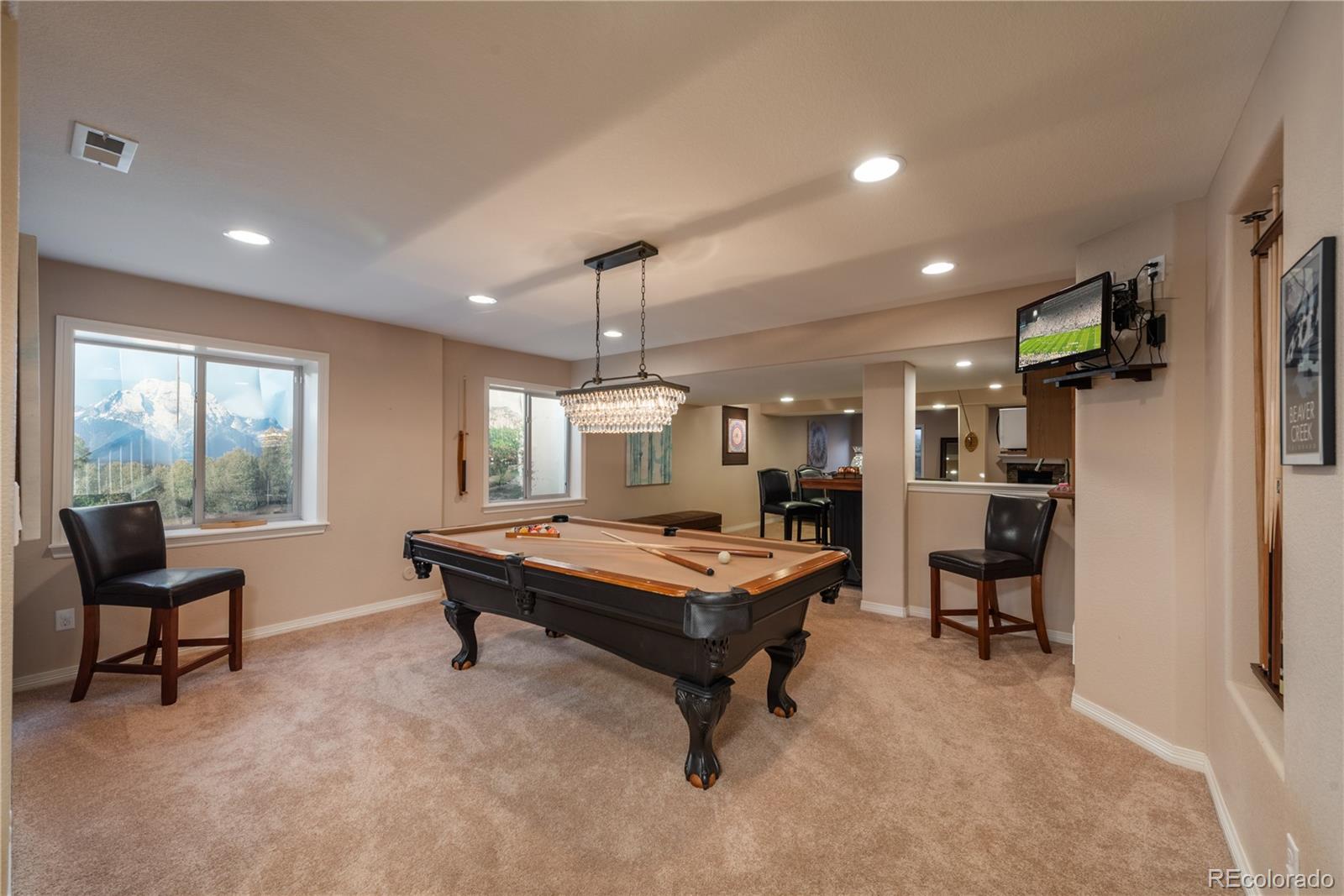 10646 Sundial Rim Road Highlands Ranch, CO 80126 - Photo 29 of 40 a room with furniture and a chandelier