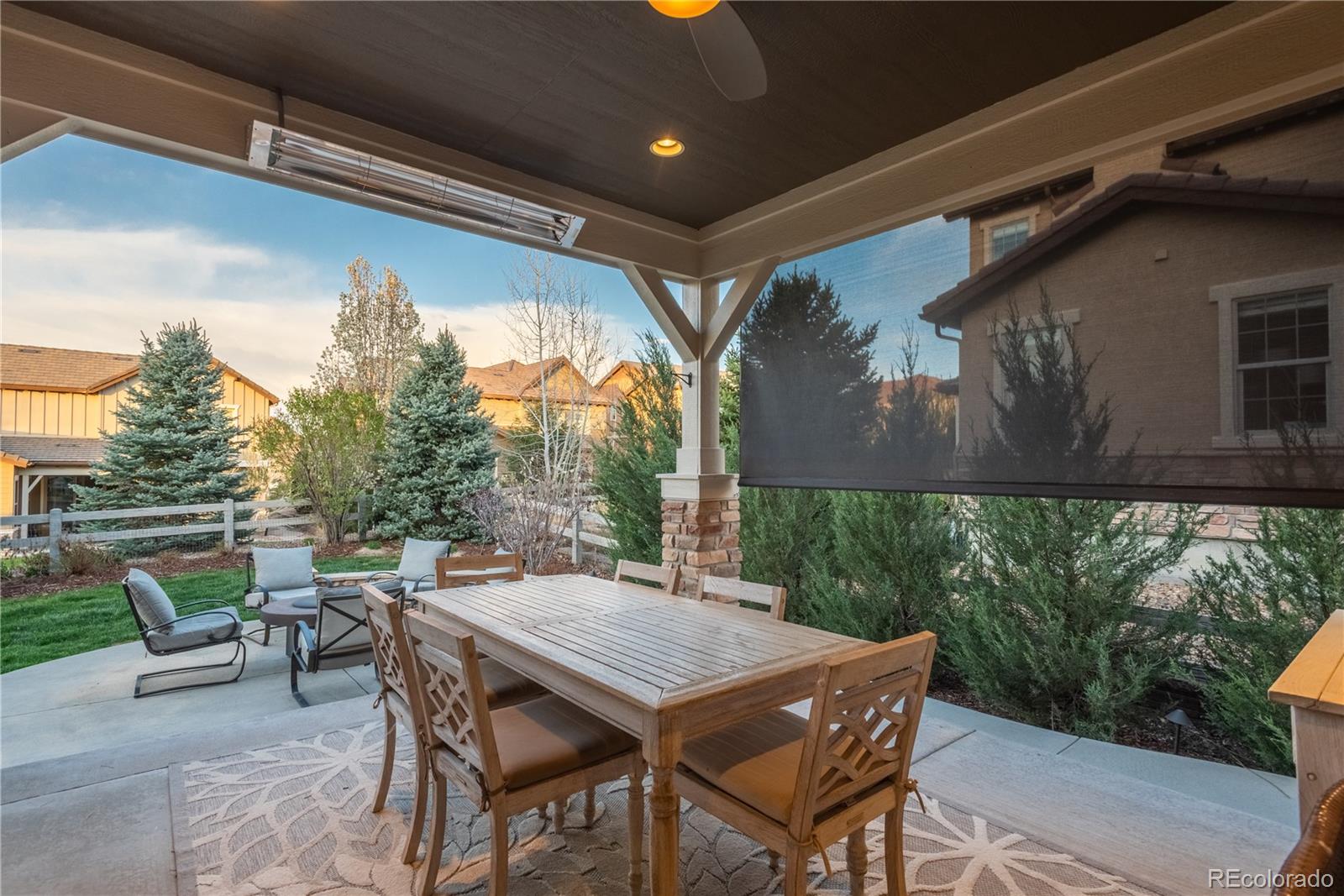 10646 Sundial Rim Road Highlands Ranch, CO 80126 - Photo 33 of 40 a patio with table and chairs