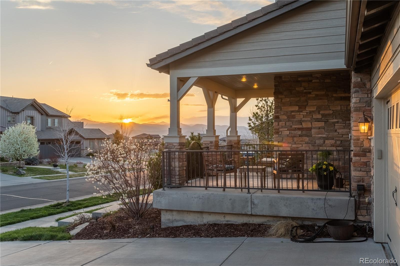 10646 Sundial Rim Road Highlands Ranch, CO 80126 - Photo 35 of 40 a view of a porch with a patio