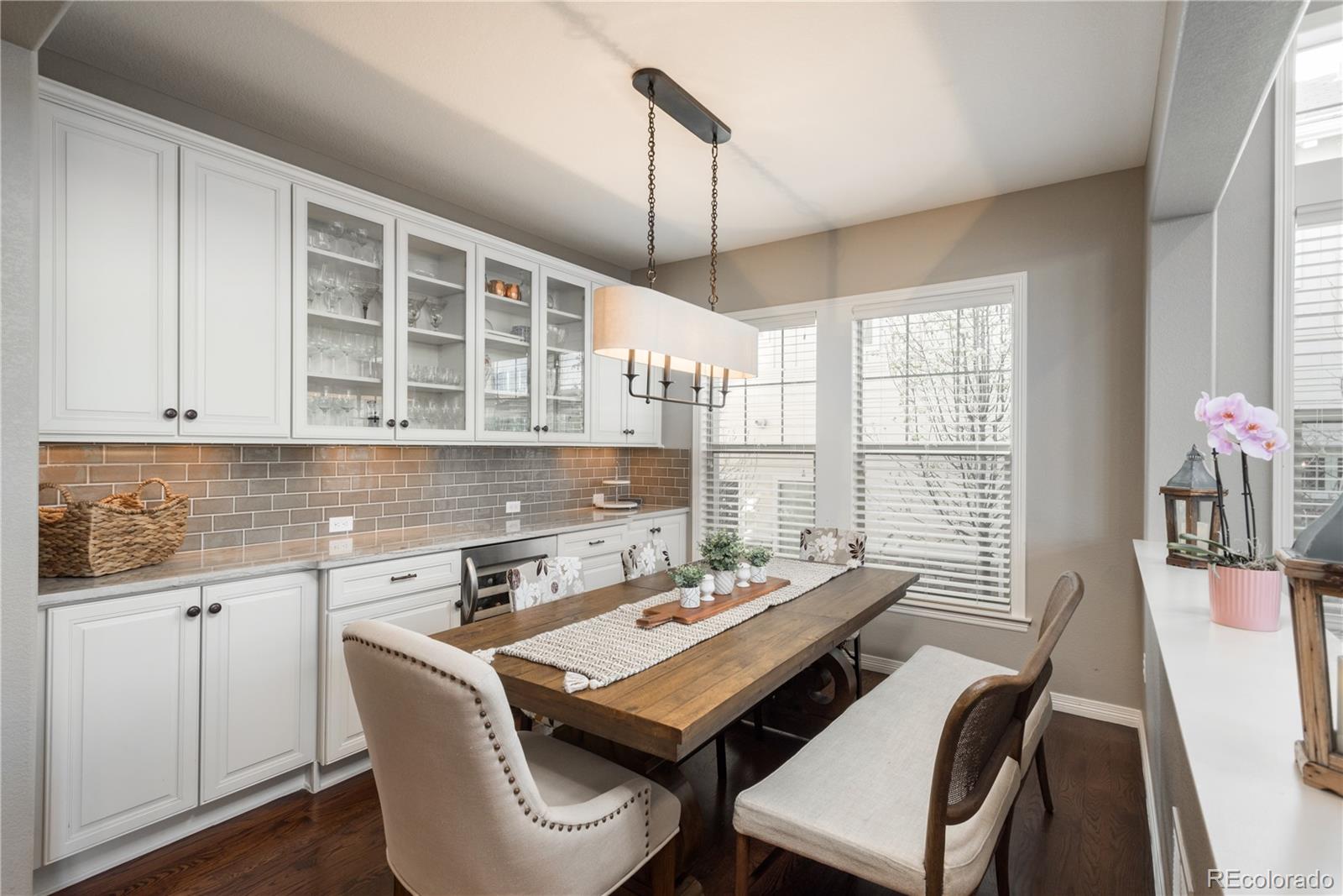 10646 Sundial Rim Road Highlands Ranch, CO 80126 - Photo 6 of 40 a view of a dining room with furniture and window