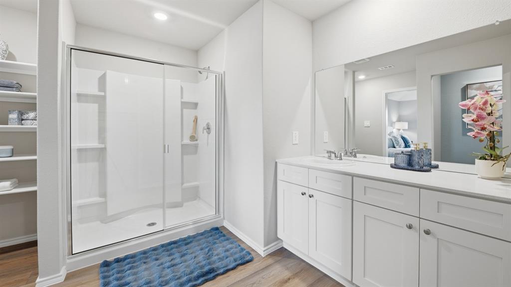 125 MLM Parkway Bridgeport, TX 76426 - Photo 16 of 35 a bathroom with a shower sink and mirror