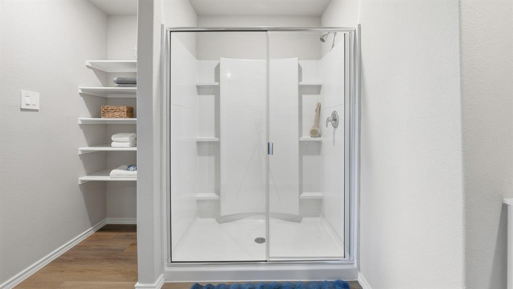 125 MLM Parkway Bridgeport, TX 76426 - Photo 17 of 35 a bathroom with a glass shower door