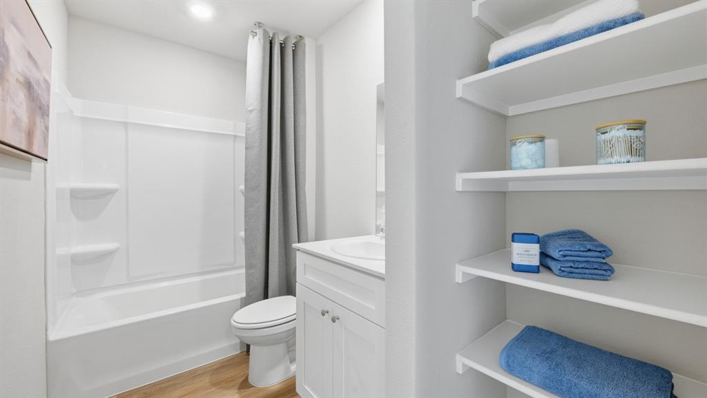 125 MLM Parkway Bridgeport, TX 76426 - Photo 23 of 35 a bathroom with a toilet and a shower