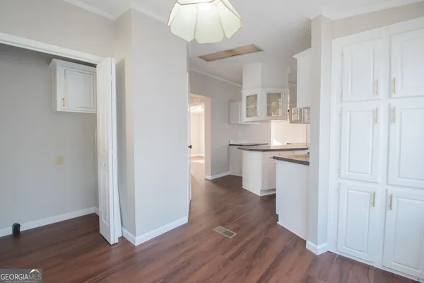 a view of kitchen with wooden floor