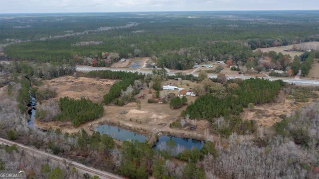 an aerial view of residential houses with outdoor space