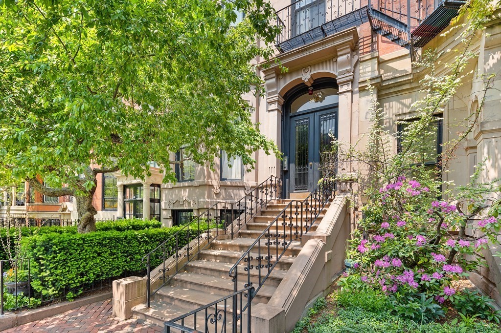 338 Beacon Street, Unit A Boston, MA 02116 - Photo 1 of 17 a front view of a house with a garden