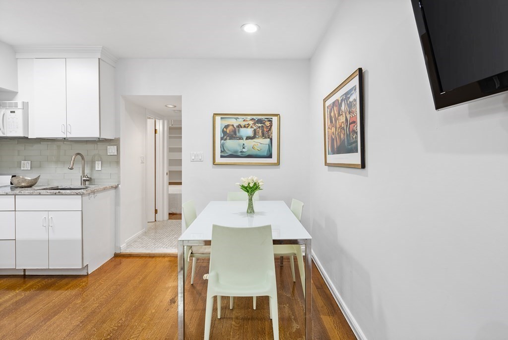 338 Beacon Street, Unit A Boston, MA 02116 - Photo 11 of 17 a dining room with furniture and wooden floor