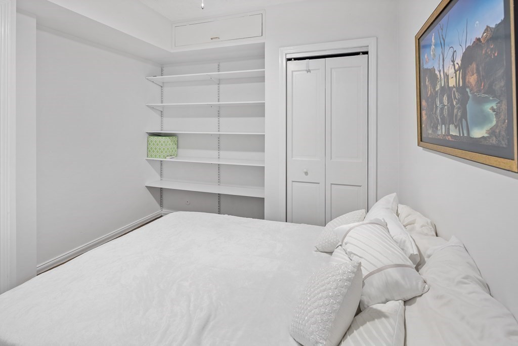 338 Beacon Street, Unit A Boston, MA 02116 - Photo 12 of 17 a bedroom with a bed and a window