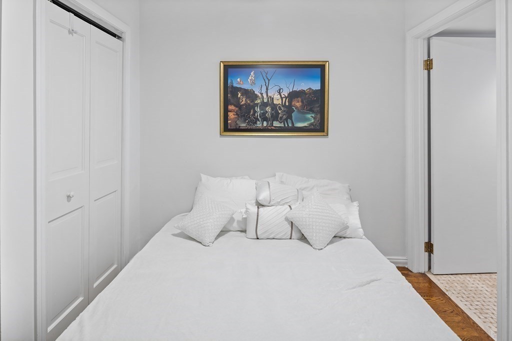 338 Beacon Street, Unit A Boston, MA 02116 - Photo 13 of 17 a large bed in a white room