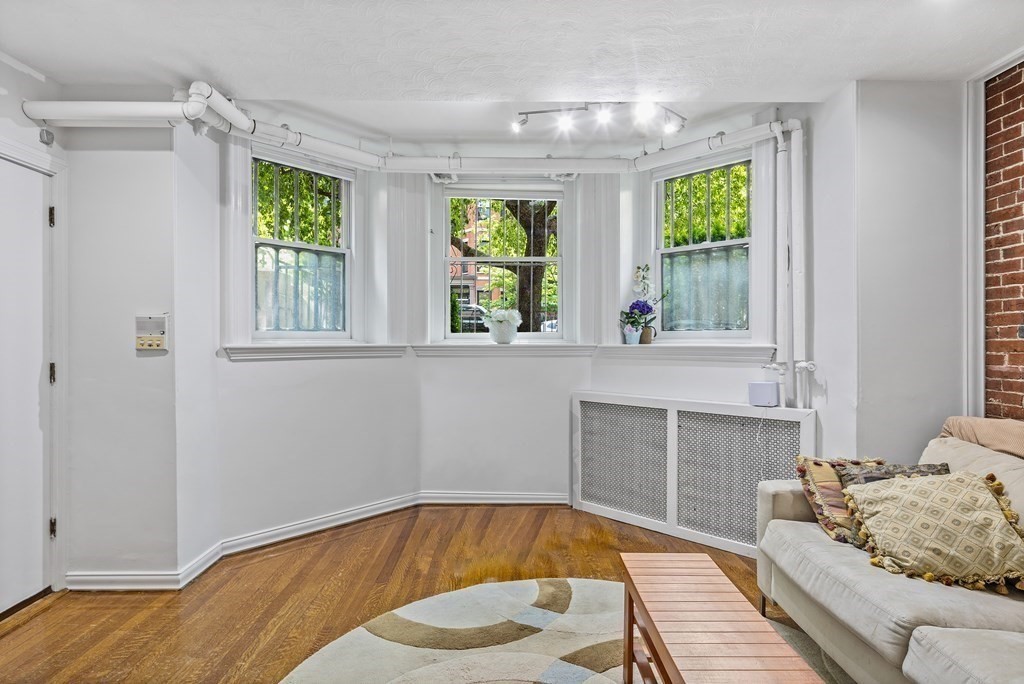 338 Beacon Street, Unit A Boston, MA 02116 - Photo 4 of 17 a bedroom with a bed and window