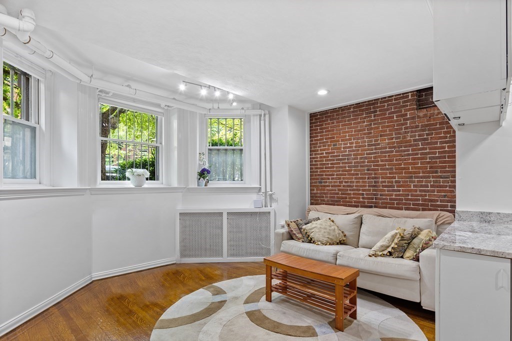 338 Beacon Street, Unit A Boston, MA 02116 - Photo 5 of 17 a living room with furniture and windows