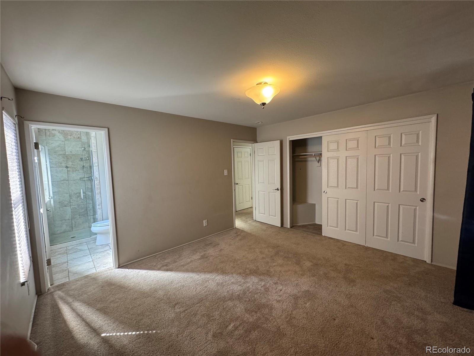 2524 South Oneida Street Denver, CO 80224 - Photo 6 of 11 a view of an empty room with a window