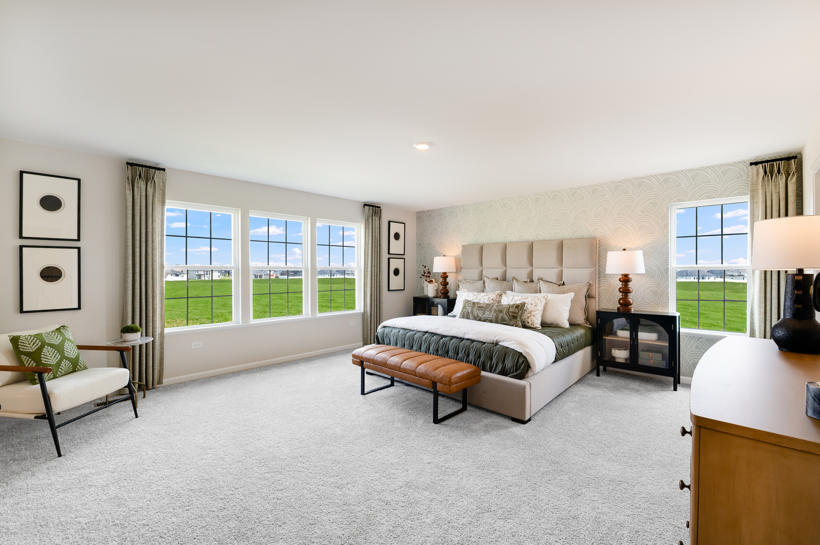 115 Henderson Street Oswego, IL 60543 - Photo 12 of 20 a spacious bedroom with a bed and a couch next to a window