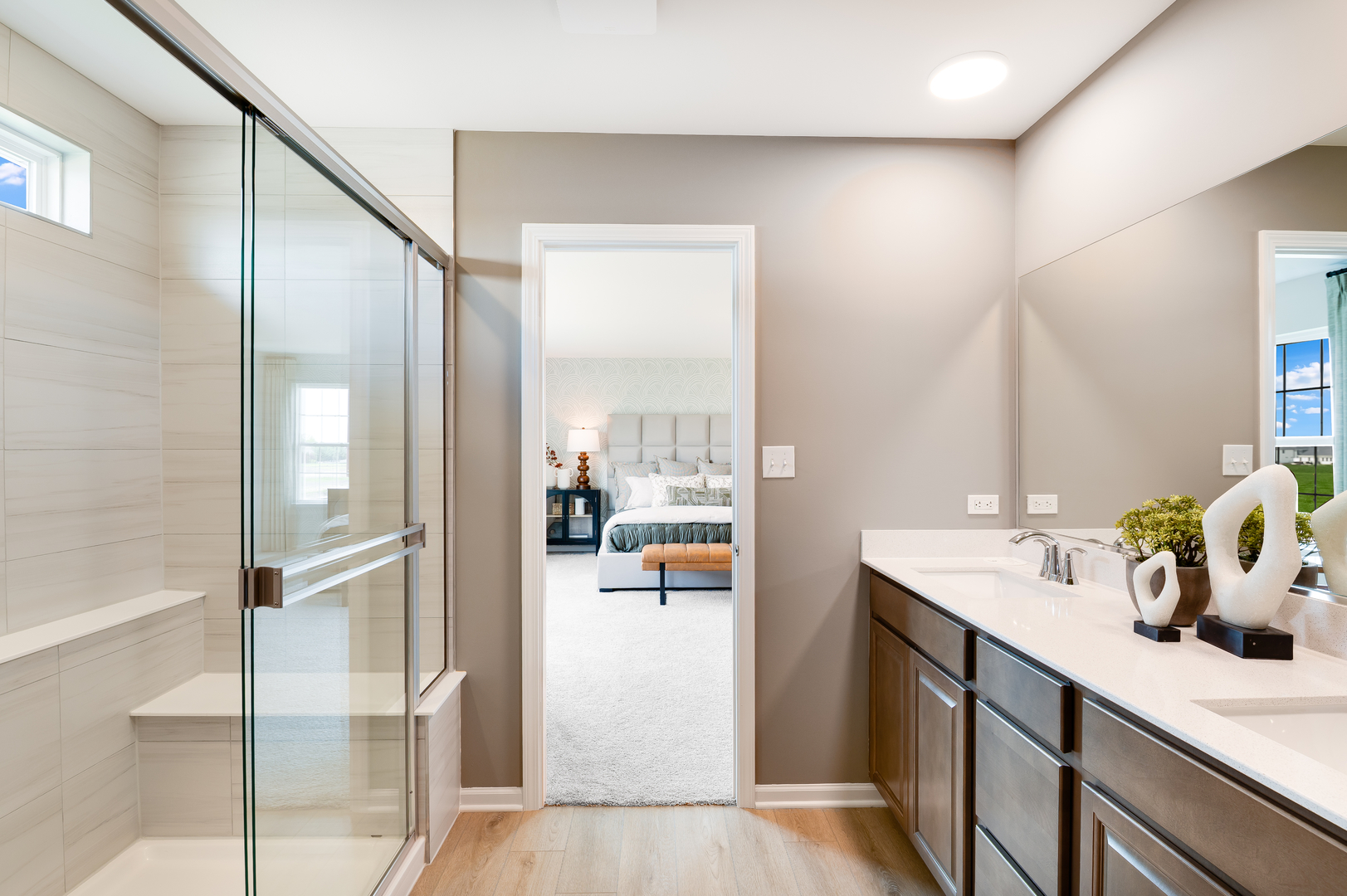 115 Henderson Street Oswego, IL 60543 - Photo 15 of 20 a en suite bathroom with a double vanity sink and mirror