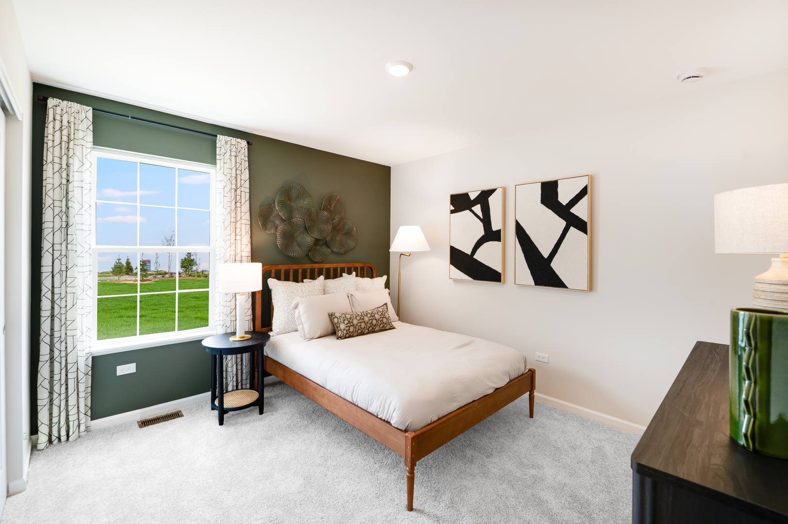 115 Henderson Street Oswego, IL 60543 - Photo 18 of 20 a bedroom with a bed and a flat screen tv