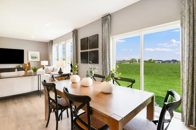 a view of a dining room with furniture window and outside view