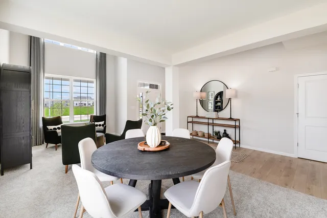 a view of a dining room and livingroom with furniture