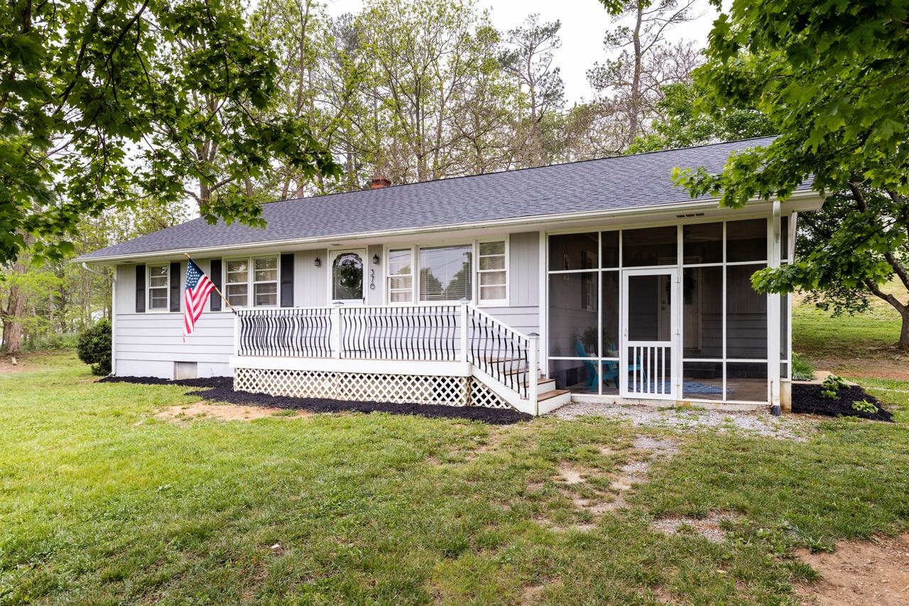 376 Kiddsville Road Fishersville, VA 22939 - Photo 20 of 31 a front view of a house with a yard table and chairs