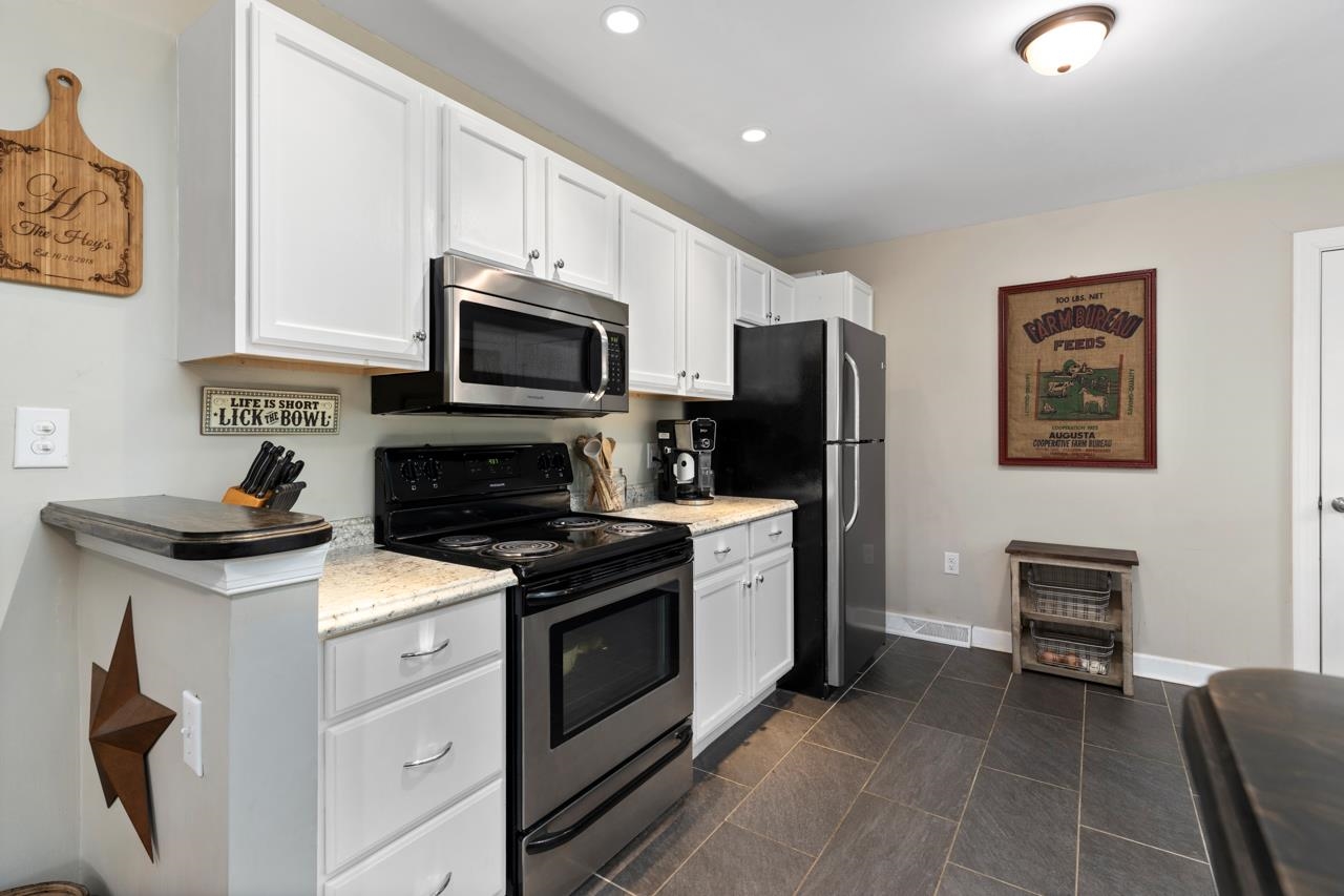 376 Kiddsville Road Fishersville, VA 22939 - Photo 2 of 31 a kitchen with stainless steel appliances a stove microwave and refrigerator