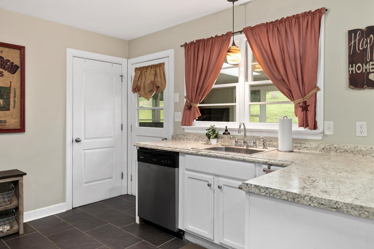 376 Kiddsville Road Fishersville, VA 22939 - Photo 7 of 31 a kitchen with a window a sink and a cabinets