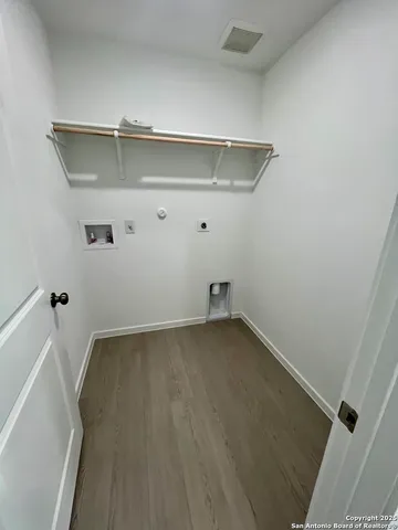 a kitchen with sink refrigerator and cabinets