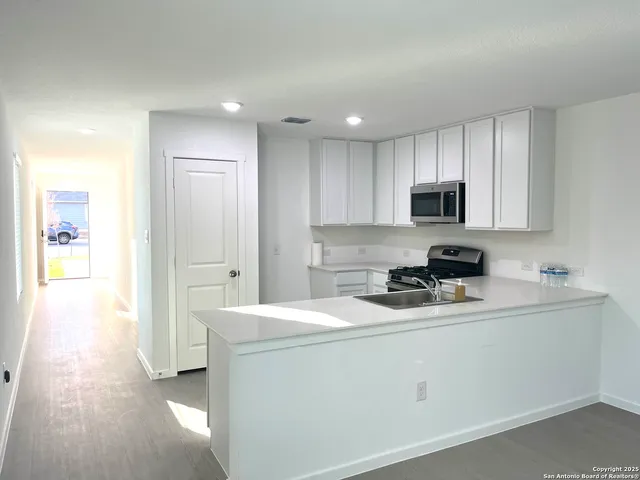 a kitchen with a stove and a microwave